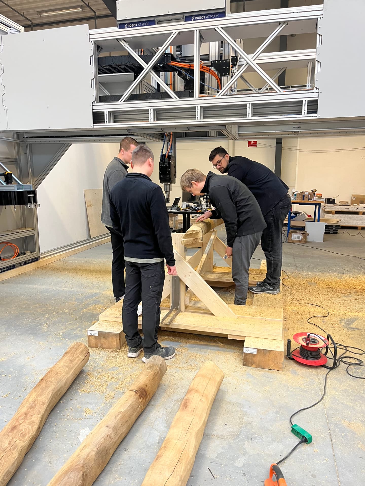 The Gantio team working with timber under the gantry system